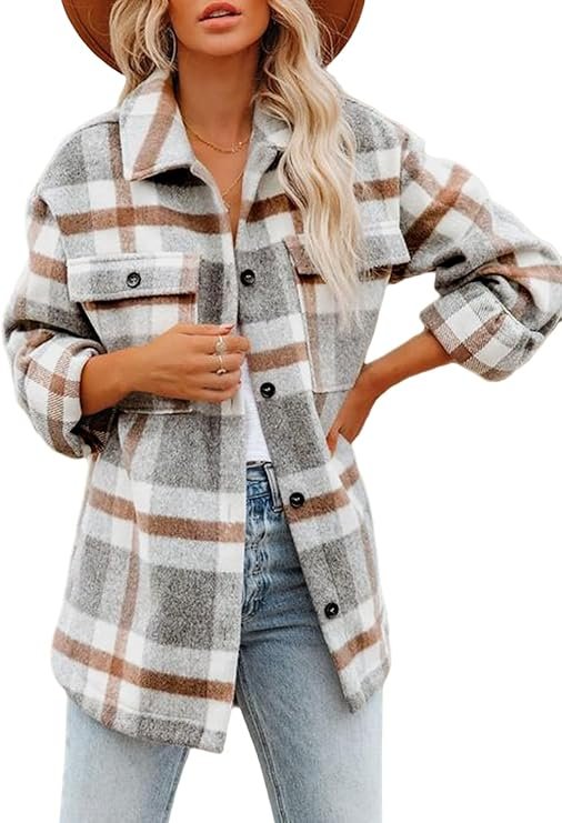 A smiling woman wearing a cozy plaid flannel shacket over a top, outdoors.