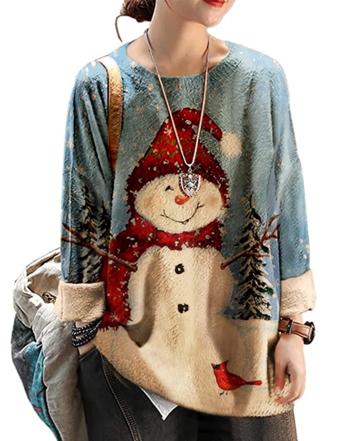 A woman cheerfully smiling while wearing an oversized graphic print Christmas sweater.