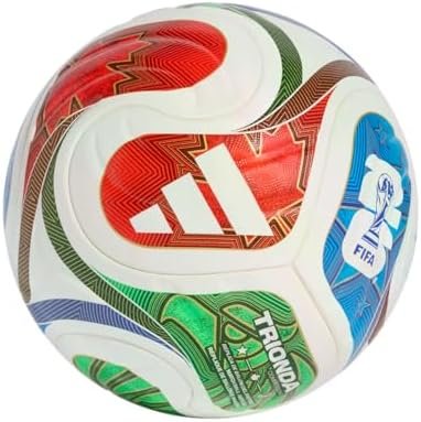 adidas World Cup 2026 Competition Ball with vibrant "la ola" wave design on a green field.